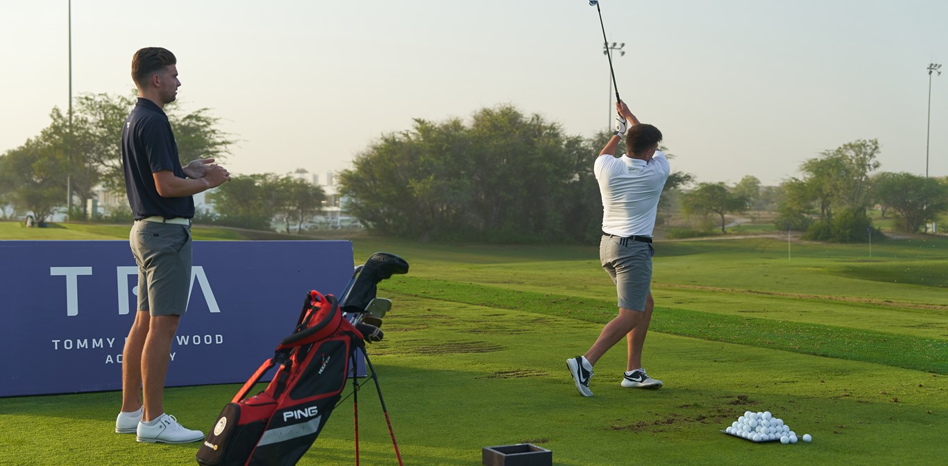 Professional golf coaching session